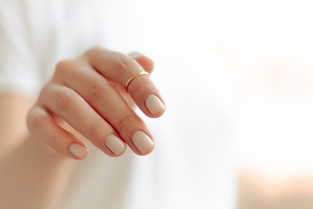 portfolio-02 persons-hand-with-white-manicure-dtowpht2-d8